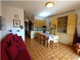 Ref. 027 &#8211; Sunny one-bedroom apartment with a splendid view over the village and the valley down to the sea.