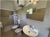 Ref. 012 – Spacious, sunny house with panoramic terrace, storage rooms and private land in front.