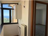 Ref. 018 – Sunny three-room flat in a traditional village house with stunning views over the valley and the sea.